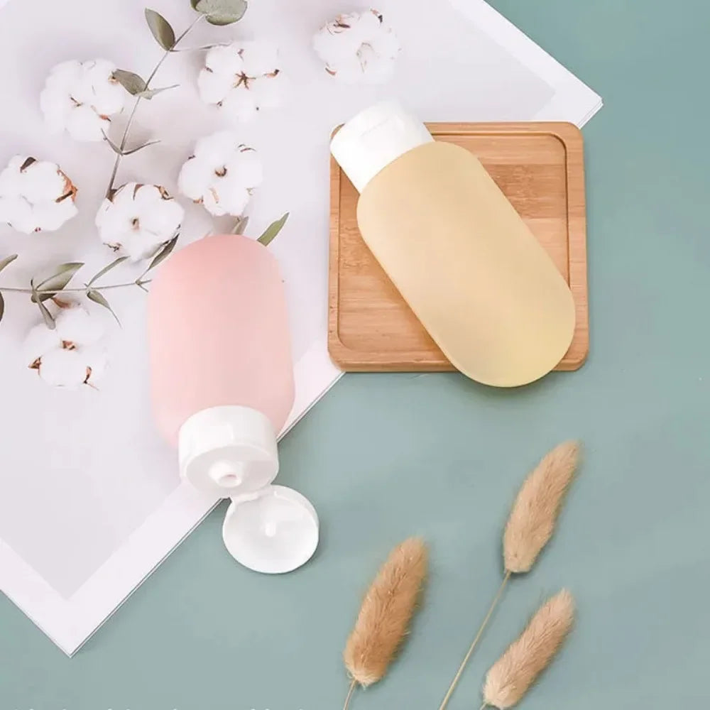 Travel Bottle Set ā 4pcs Refillable 60ml + 12 Soft Tubes.