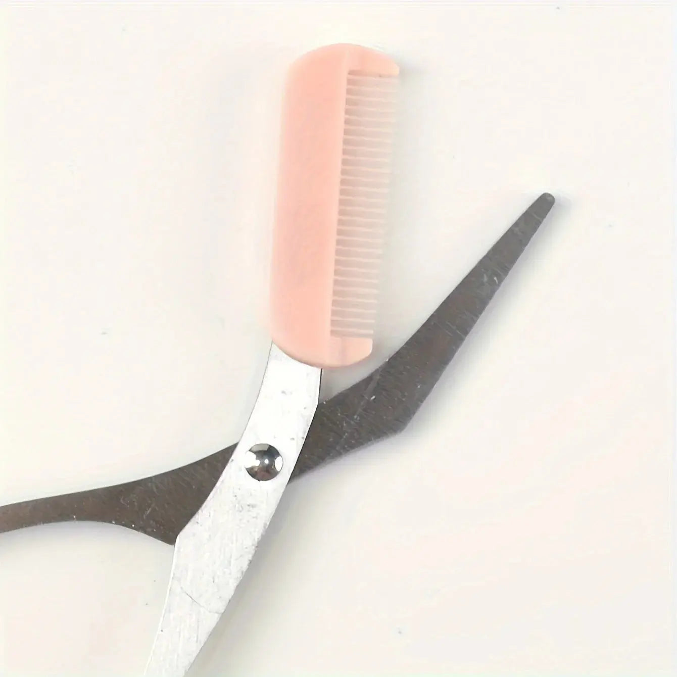 Pink eyebrow trimming scissors with built-in comb - stainless steel, precise grooming tool, creating perfect eyebrows Makeup art