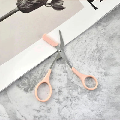 Pink eyebrow trimming scissors with built-in comb - stainless steel, precise grooming tool, creating perfect eyebrows Makeup art
