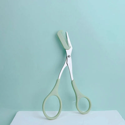 Pink eyebrow trimming scissors with built-in comb - stainless steel, precise grooming tool, creating perfect eyebrows Makeup art